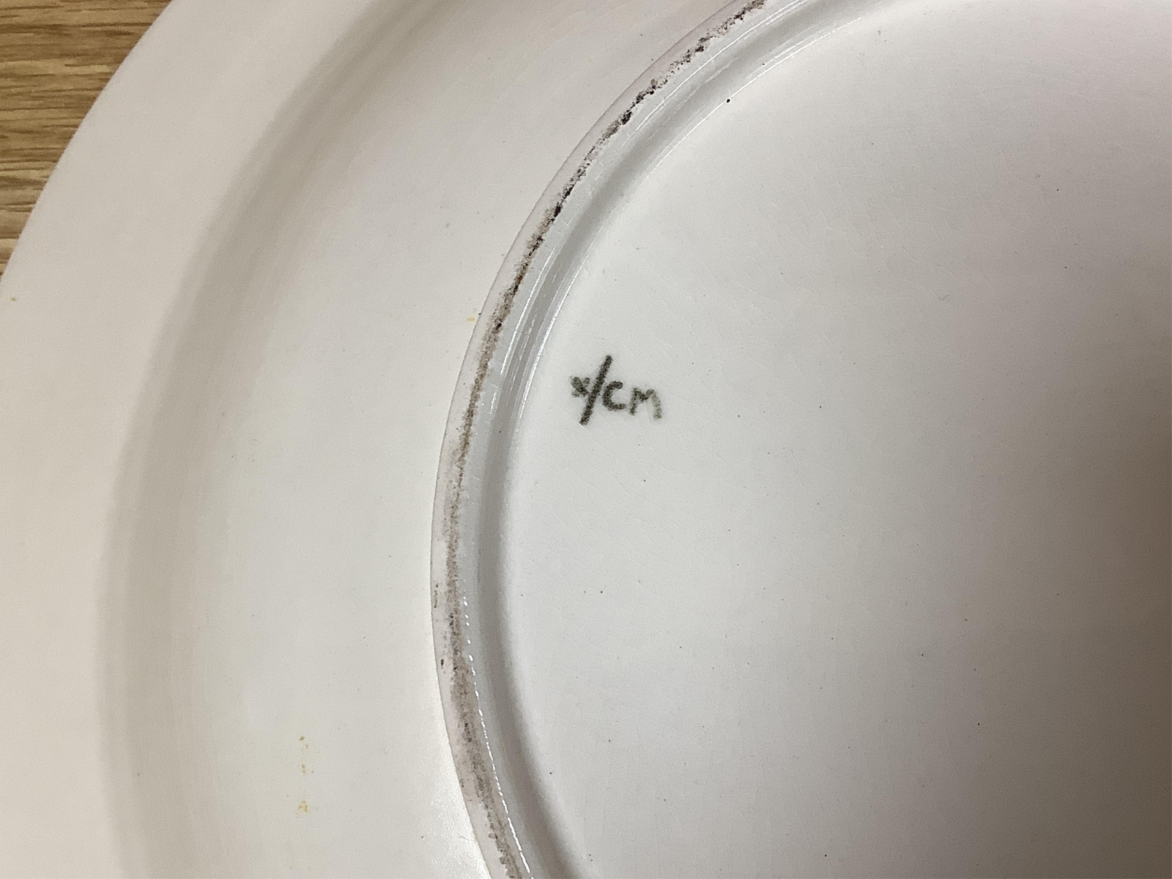 Olive Bourne for Poole pottery ‘sugar for the birds’, a large dish, stamped to the base, 38cm in diameter